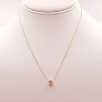 Gold INITIAL S GOLD NECKLACE featuring a small gold disc from Daisy Lane’s dainty initial collection