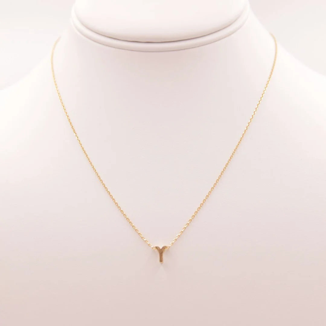 Dainty Initial Y Gold Necklace featuring a gold design with a small white pearl from Daisy Lane