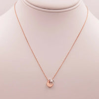 Elegant Moon & Star Necklace featuring a gold design and small diamond accent