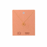 Gold Pisces Zodiac Sign Necklace with a small initial charm elegantly displayed