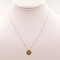 Gold Sagittarius Zodiac Sign Necklace featuring a small coin charm