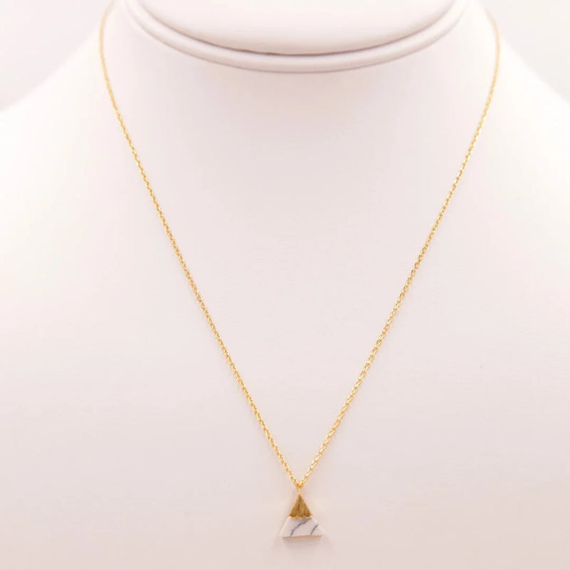 Gold necklace featuring a white marble triangle pendant from Daisy Lane collection