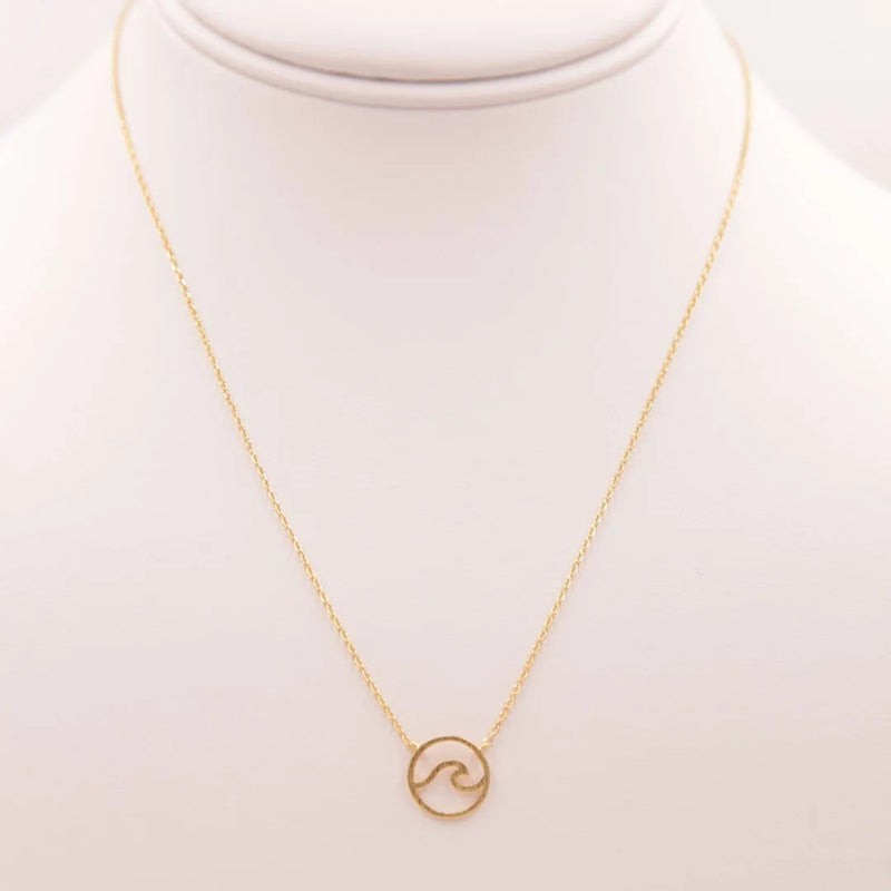 Gold Wave Necklace featuring a delicate gold necklace with a small circular pendant