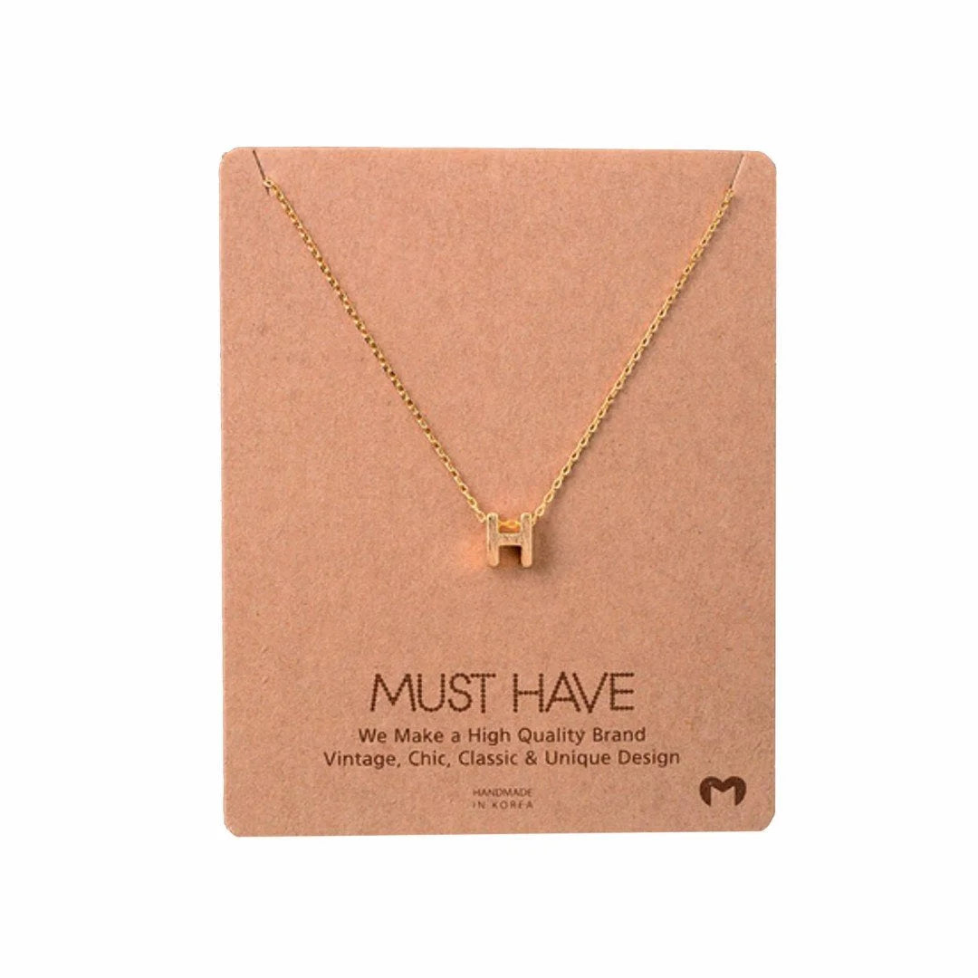 Delicate Initial H Gold Necklace featuring a tiny heart charm from Daisy Lane