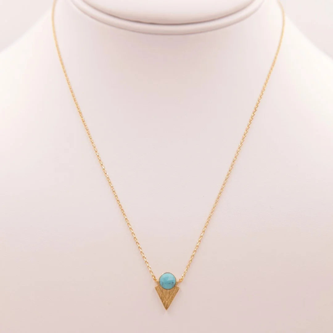 Gold & Turquoise Pendant Necklace featuring a stunning turquoise stone centerpiece