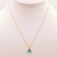 Gold necklace with a triangle turquoise stone from the Triangle Turquoise Marble Necklace