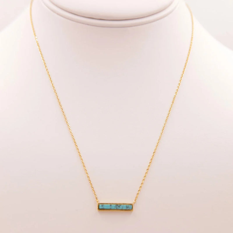 Elegant gold necklace featuring a turquoise stone in a Turquoise Marble Necklace design