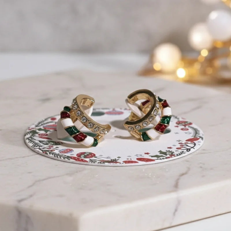 Festive candy cane sparkle clip-on earrings with gold, red, and rhinestones