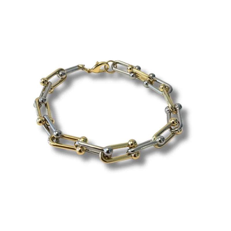 Bohemian dual tone bracelet with gold and silver links and toggle clasp