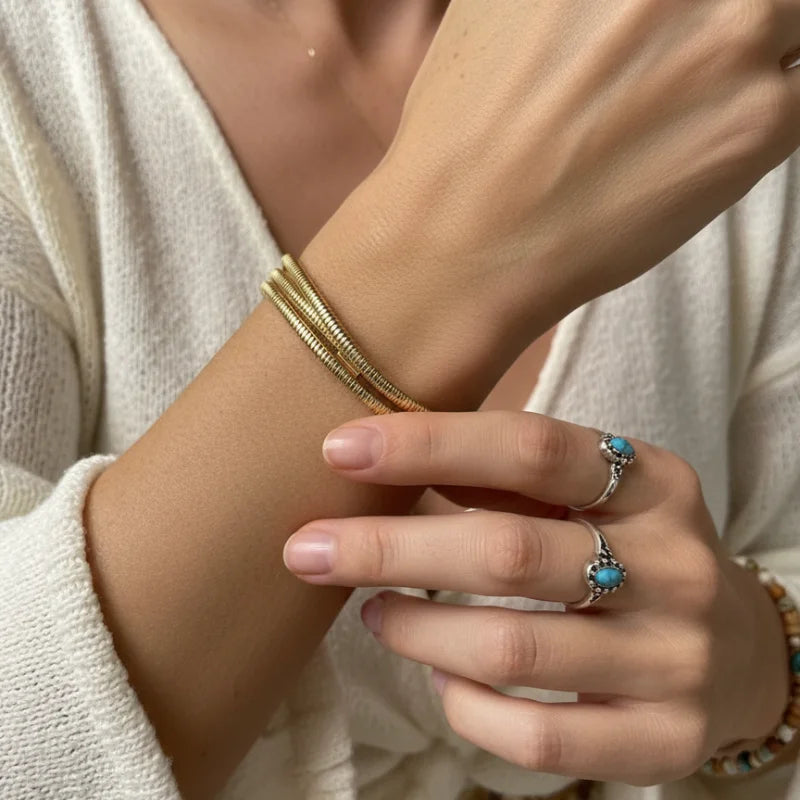Golden coiled boho bracelet with gold snake chain and turquoise stones