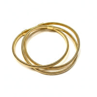 Golden coiled boho bracelet with textured snake chain and magnetic clasp