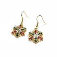 Festive rhinestone snowflake earrings with gold, red, and green accents