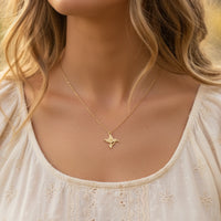 Gold dipped hummingbird necklace with a delicate chain and simple design