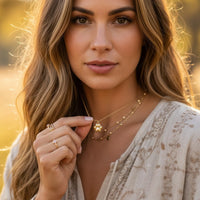 Gold star necklace with beaded chain and paw print soul pendant for the Gold Paw Print Soul Necklace