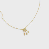 Gold-toned dream catcher necklace with white diamonds and three leaf-shaped charms