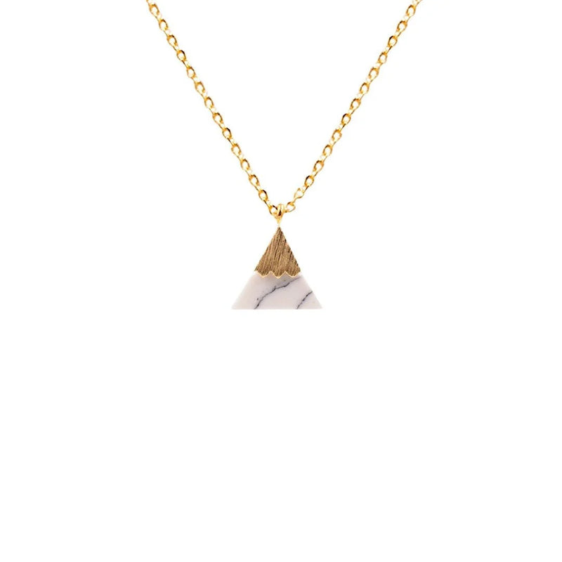 Elegant gold triangle necklace showcasing a stunning white marble design by Daisy Lane