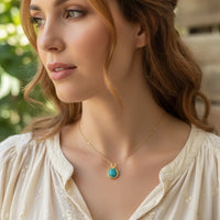 Gold dipped turquoise gold boho necklace with intricate detailing in a stylish pendant