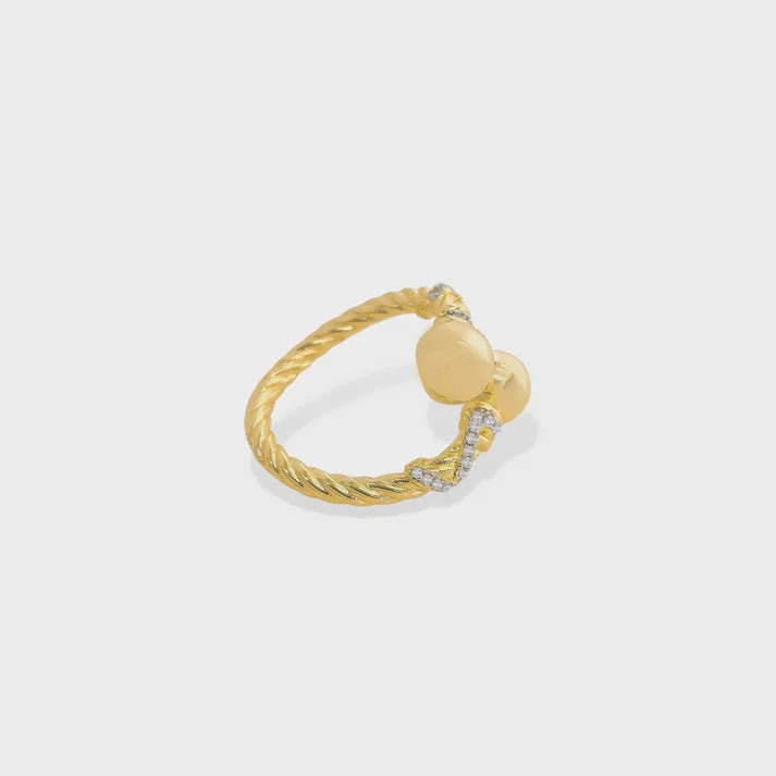 Gold twisted cable ring with heart-shaped elements and diamond accents, two tone adjustable ring