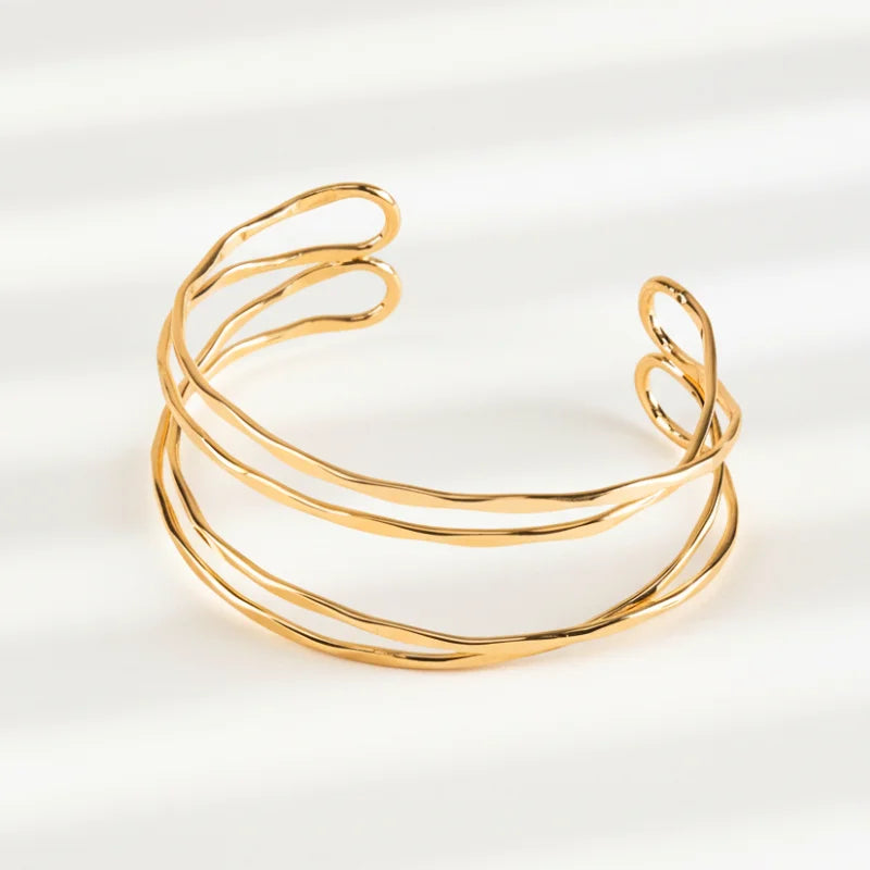 Twisted hammered cuff gold bracelet with hammered details