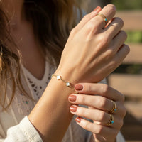 Gold dipped dainty clover bracelet with gold and white beads for women’s boho chic