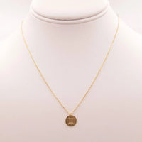 Gold Gemini Zodiac Sign Necklace elegantly displayed, perfect for celebrating the Gemini zodiac