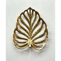 Golden metallic cast iron leaf brooch featuring an intricate openwork design