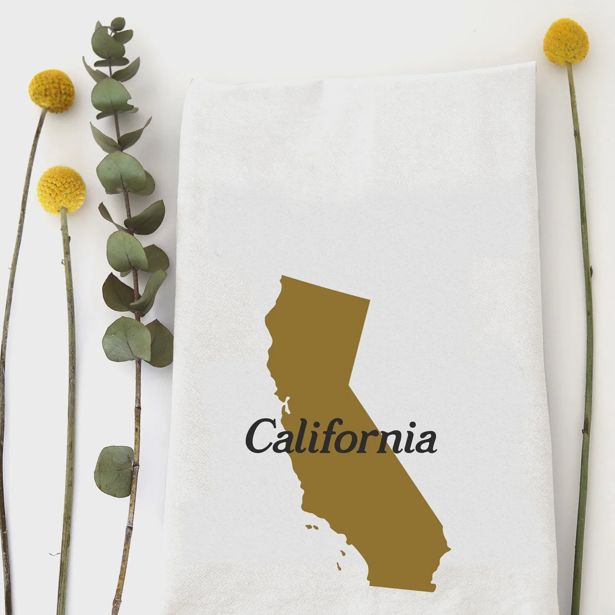 Golden silhouette of California state with text California, ideal for California kitchen hand tea towel