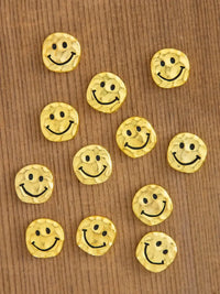 Golden smiley face buttons from the BAG OF TINY TOKENS, perfect for women’s boho chic clothing
