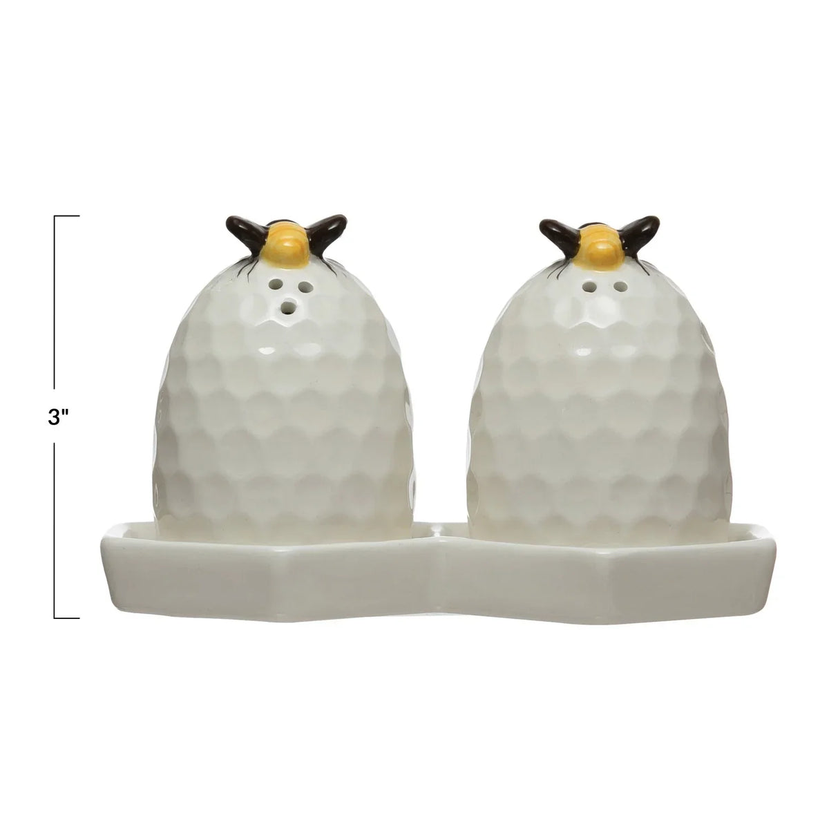 Golf ball-shaped beehive salt and pepper shakers with honeycomb plate design