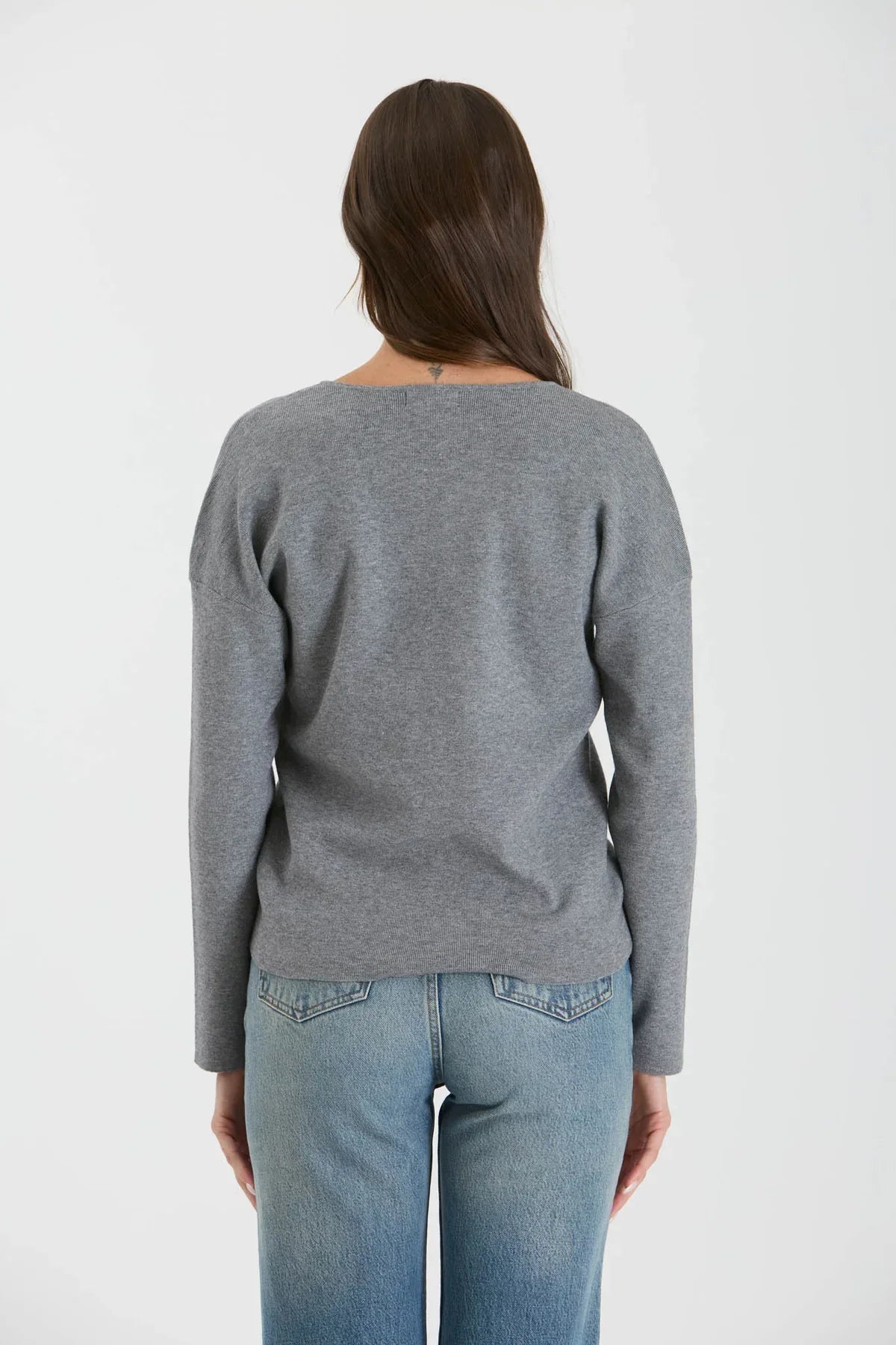 Gray crewneck sweatshirt back view showcasing drop shoulder relaxed fit seam knit sweater