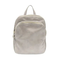 Gray leather FRANKIE SOFT LEATHER BACKPACK featuring logo zip pulls and sleek design