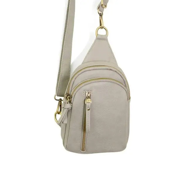 Gray vegan leather Skyler Sling Bag with a convertible strap for versatile style