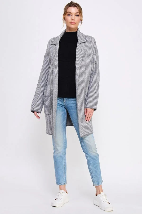 Gray oversized Diagonal Striped Plush Open Coatigan over black top and blue jeans