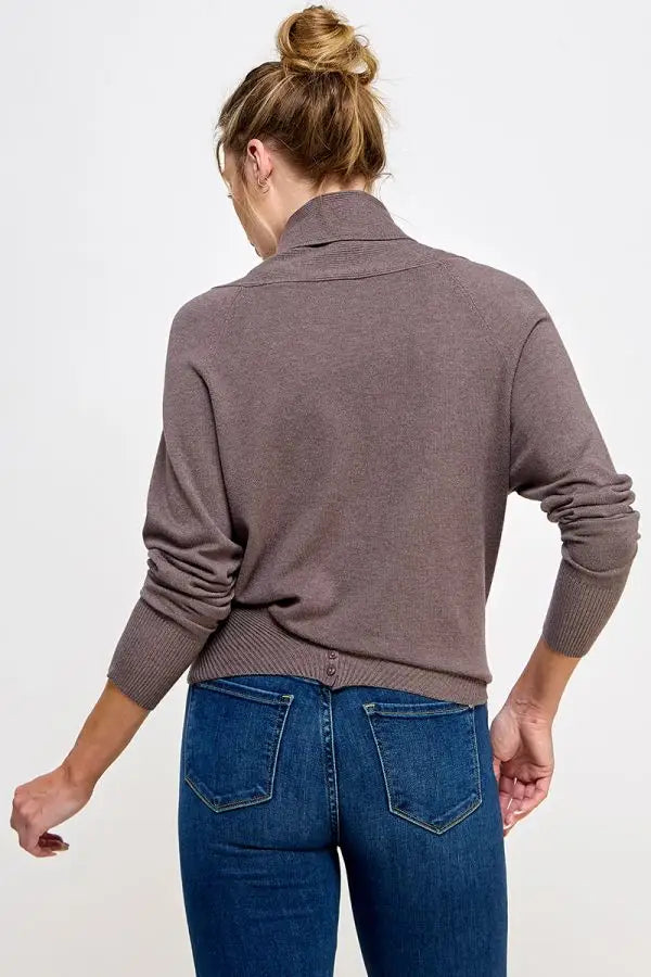 Gray turtleneck sweater with blue jeans showcasing soft mixed texture in wrap design