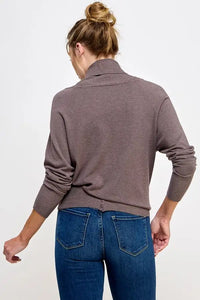 Gray turtleneck sweater with blue jeans showcasing soft mixed texture in wrap design