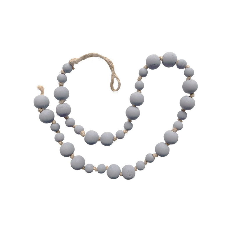 Gray wooden prayer beads on rope, ideal for enhancing women’s boho chic clothing from Shop Daisy