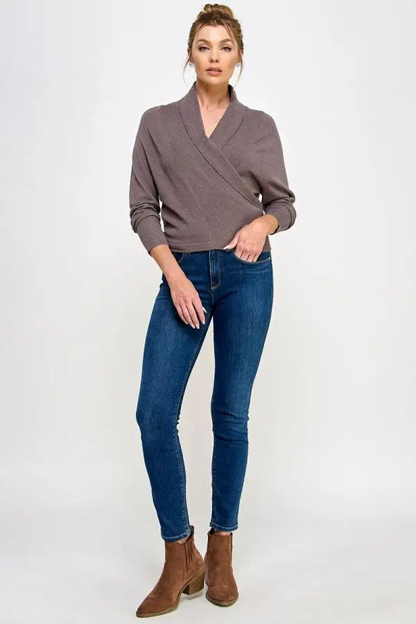 Gray soft mixed texture wrap sweater with long sleeves styled with blue jeans and brown ankle boots