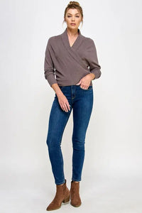 Gray soft mixed texture wrap sweater with long sleeves styled with blue jeans and brown ankle boots