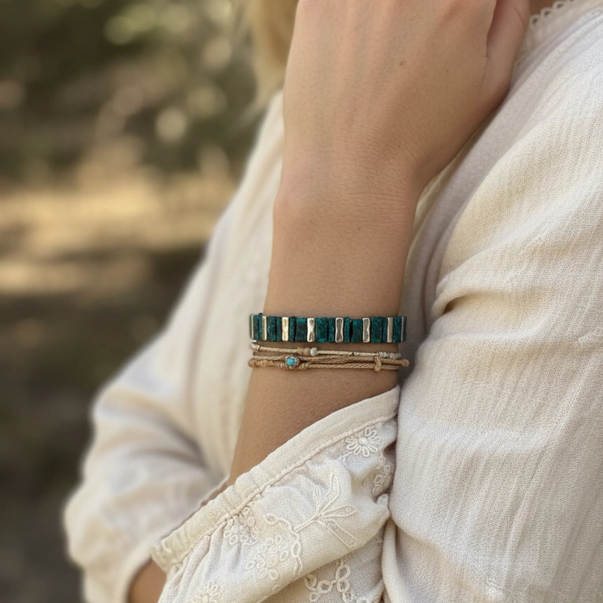 Artisan teal silver stretch bracelet with green beads and gold accents