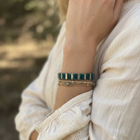 Artisan teal silver stretch bracelet with green beads and gold accents
