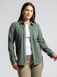 Green plush collared button-down shirt layered over a white top with khaki pants