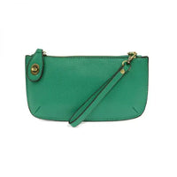 Green faux leather wristlet with card slots from the MINI CROSSBODY WRISTLET CLUTCH