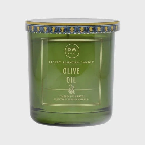 Green glass candle jar with Olive Oil scent from DW, perfect for women’s boho chic clothing