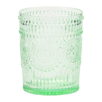 Green glass tumbler with ornate embossed design, ideal as an embossed drinking glass