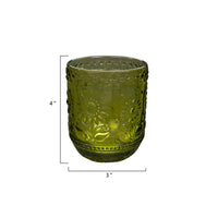 Green glass tumbler with embossed floral pattern for an elegant drinking experience