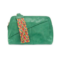 Green vegan leather clutch featuring a colorful woven wristlet strap and zip closure