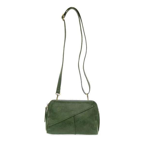 Green vegan leather crossbody handbag with zip closure and woven wristlet strap detail