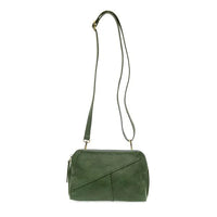 Green vegan leather crossbody handbag with zip closure and woven wristlet strap detail