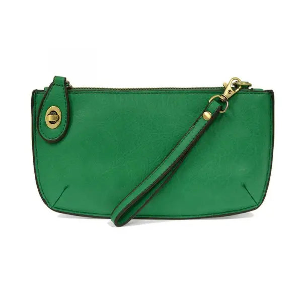 Green leather wristlet clutch featuring card slots from Shop Daisy’s women’s boho chic collection