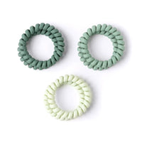 Set of three Crush Spiraling Coil hair ties in green matte rubber